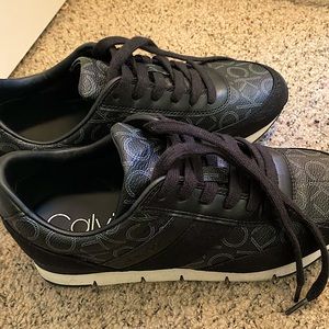 black Calvin Klein tennis shoes